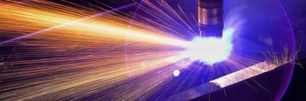 Plasma torch throwing sparks while cutting steel plate at Seaport Steel