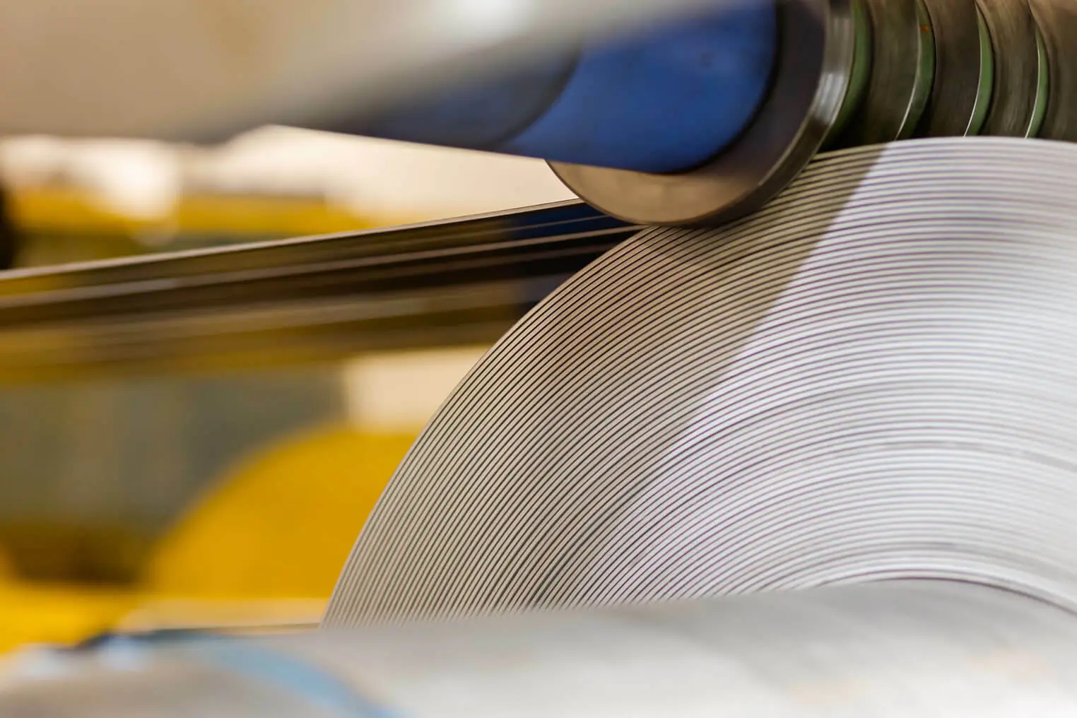 Slit steel strands winding onto a recoiler on a Siegal Steel slitting line