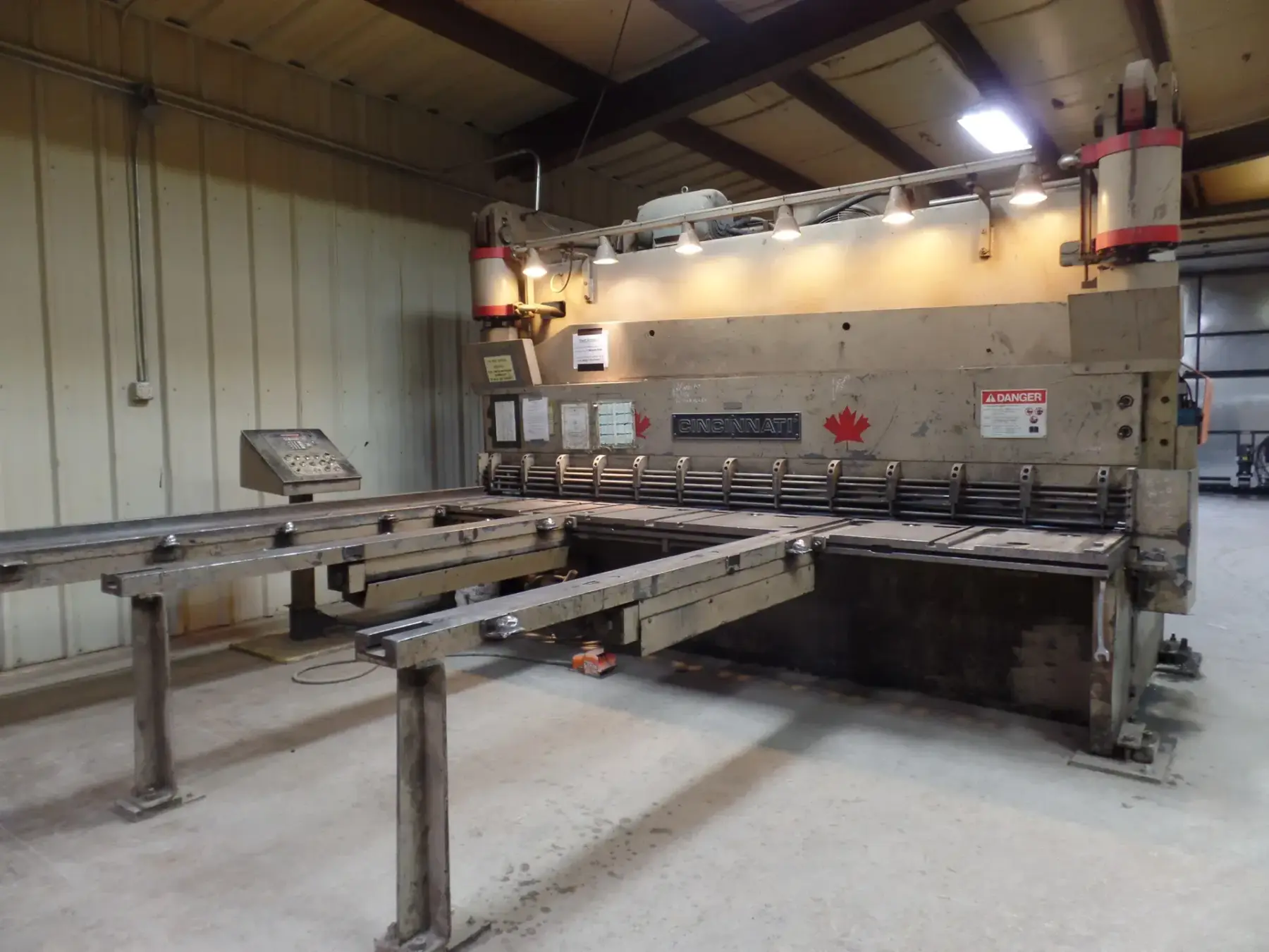 12-foot Cincinnati hydraulic shear with roller conveyor tables in the Steel Sales shop