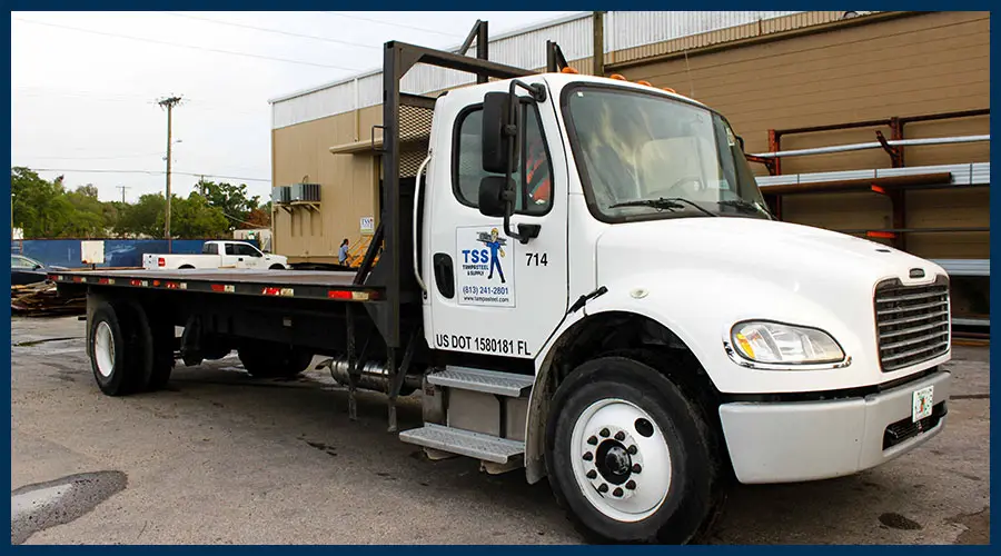 Tampa Steel & Supply flatbed delivery truck parked outside the Ybor City warehouse