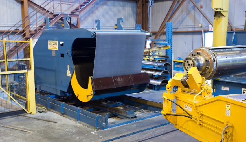 Entry end of a Taylor Steel Herr-Voss slitting line with a coil car and uncoiler