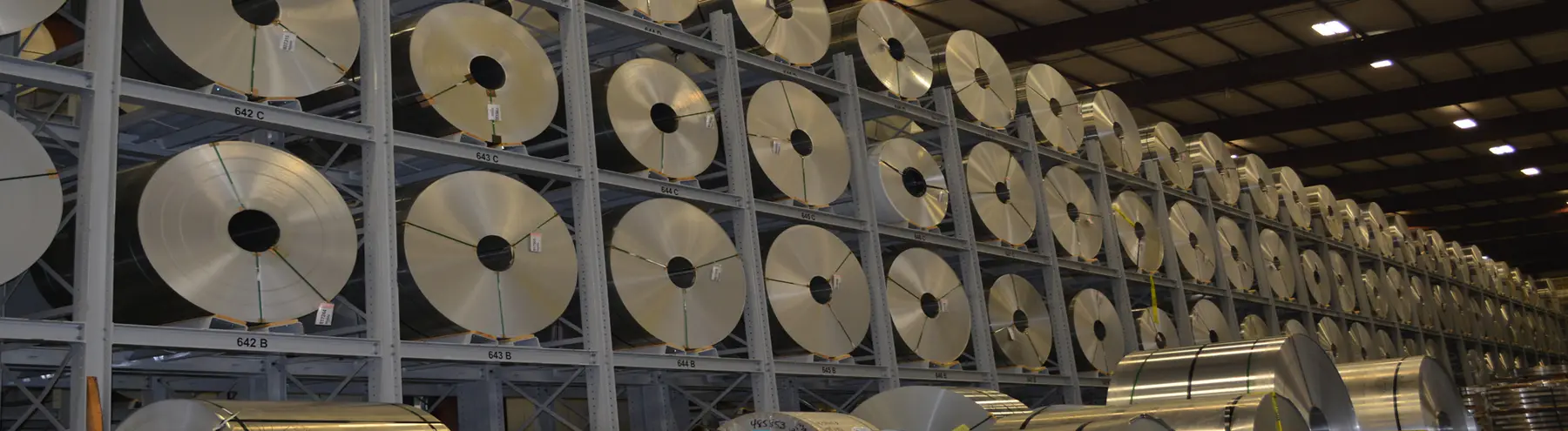 Aluminum and steel coils stored in high-rise racks in a Diez Group warehouse