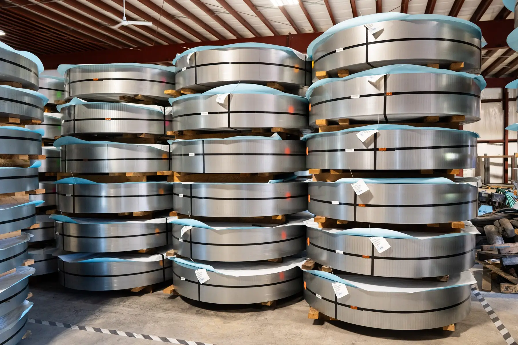 Stacked slit coils on pallets in The Material Works' climate-controlled storage