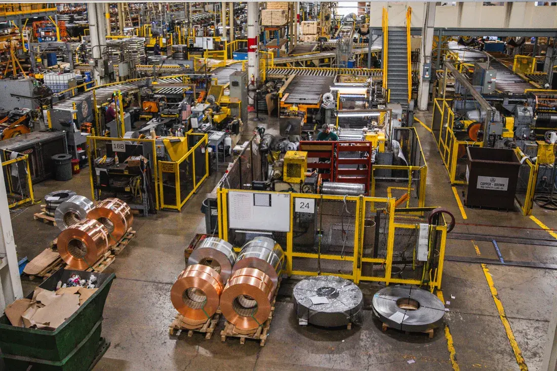 Overhead view of the Three D Metals production floor with slitting lines and slit copper and steel coils