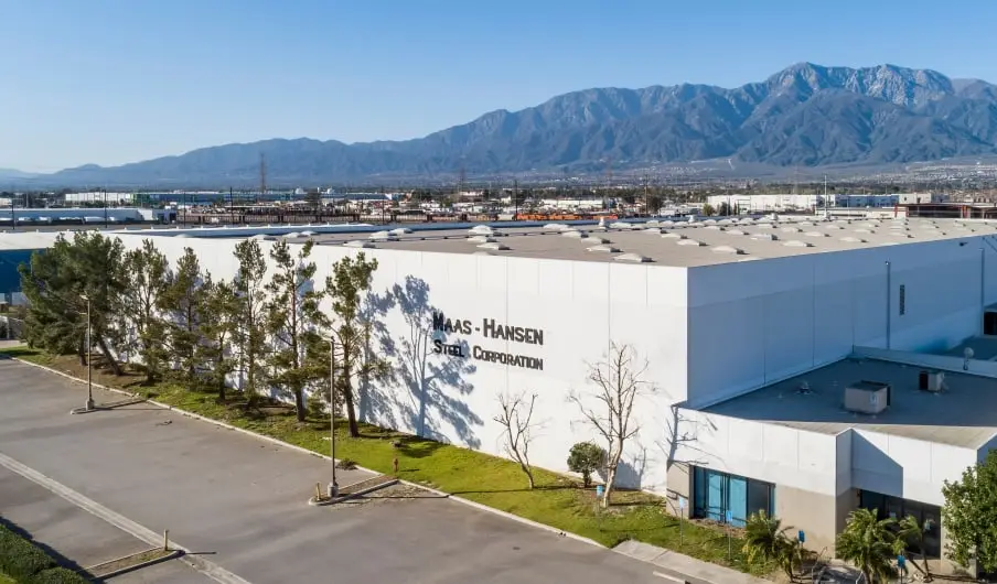 Maas-Hansen Steel building exterior with mountains in the background