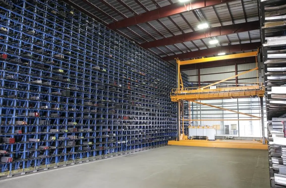 Tall automated storage racks for long steel products inside a warehouse