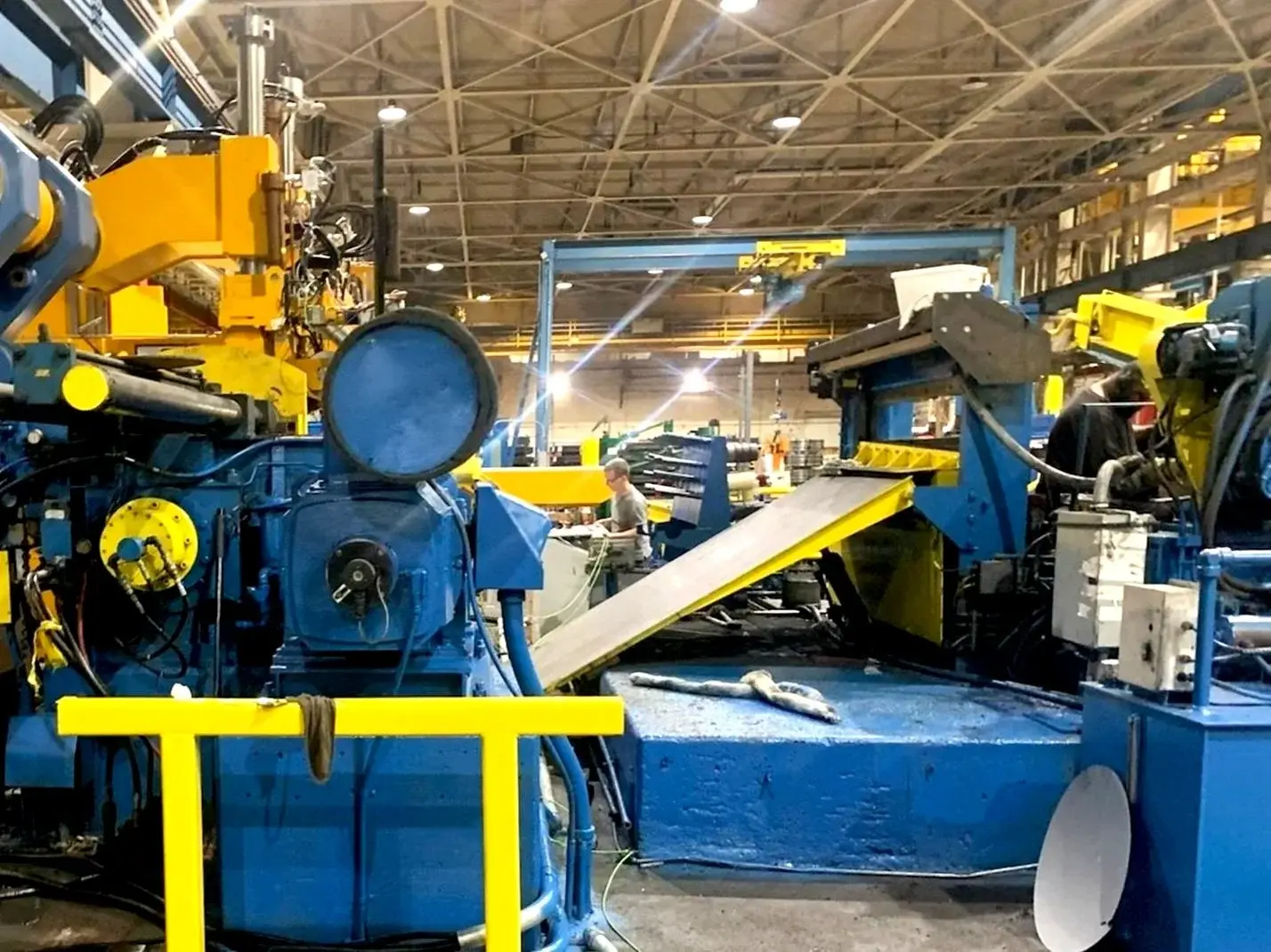 Entry end of a VAP Steel coil slitting line with strip feeding into the slitter