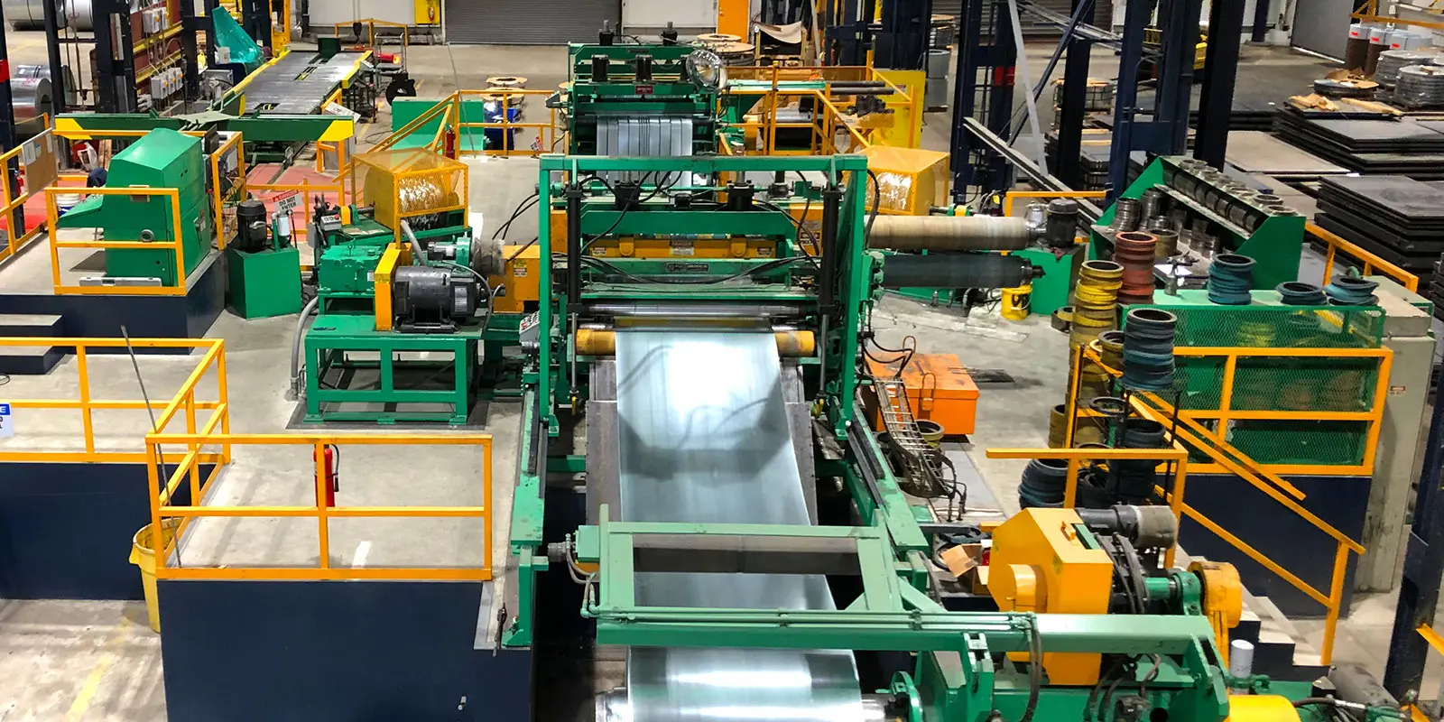 Vision Metals' Braner slitting line running coated steel coil in the Tucker processing bay