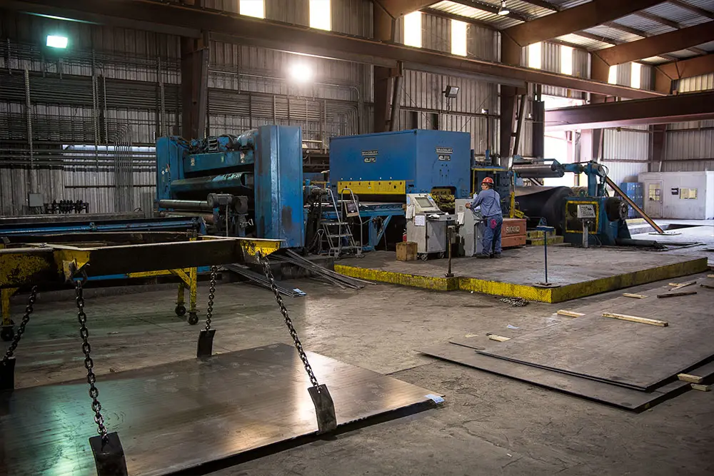 Cut-to-length line producing heavy steel plate on the Willbanks Metals plant floor